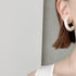 401. Big hoop earring