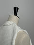 1096. compact volume knit vest