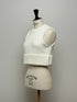 1096. compact volume knit vest